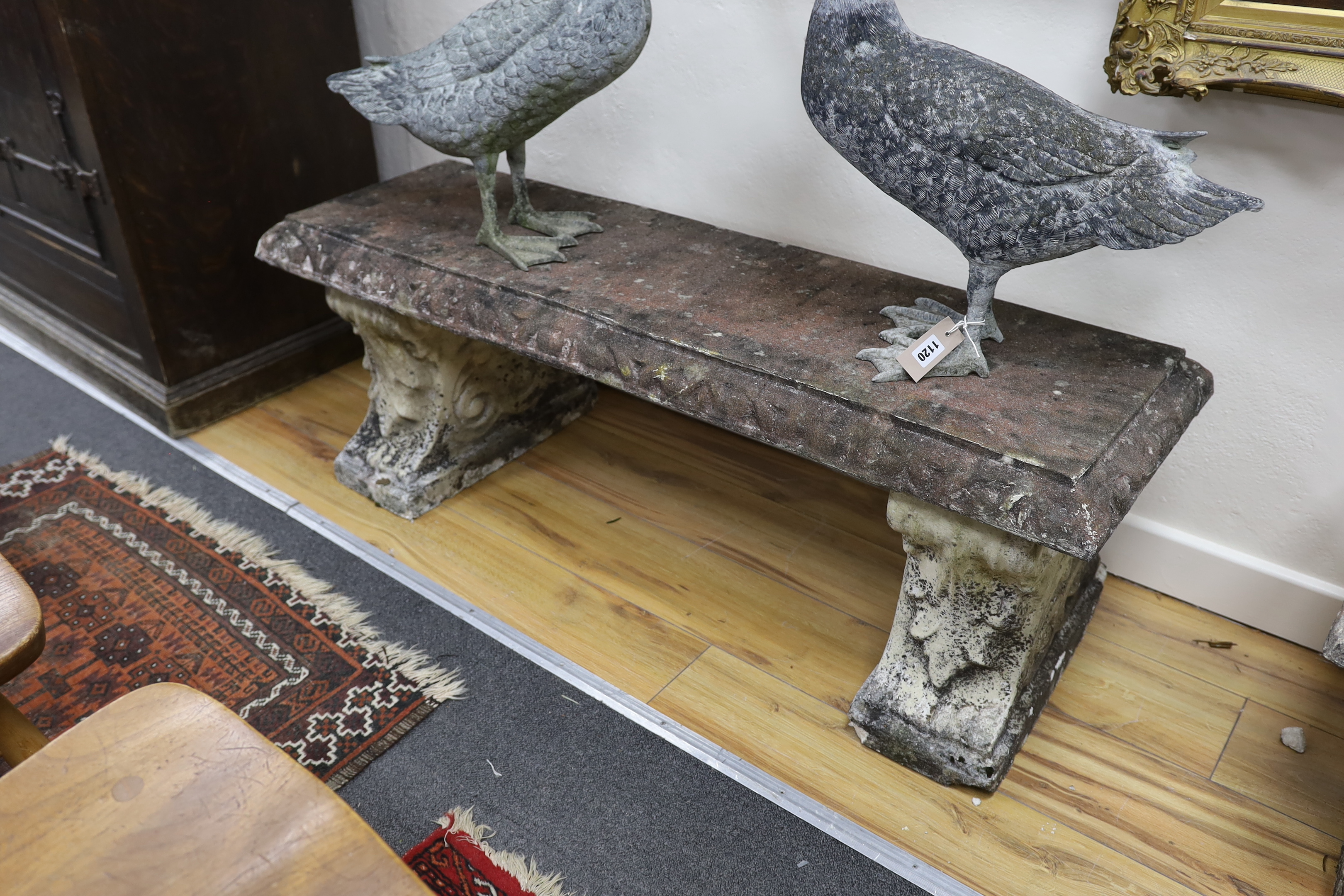 A pair of rectangular reconstituted stone garden bench seats, width 125cm, depth 40cm, height 42cm